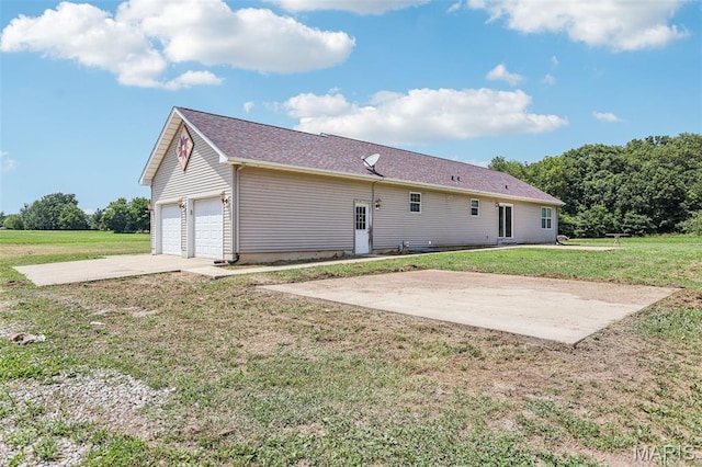 1518 Old Ripley Rd, Sorento, IL 62086 - rear view of house with a garage and a lawn