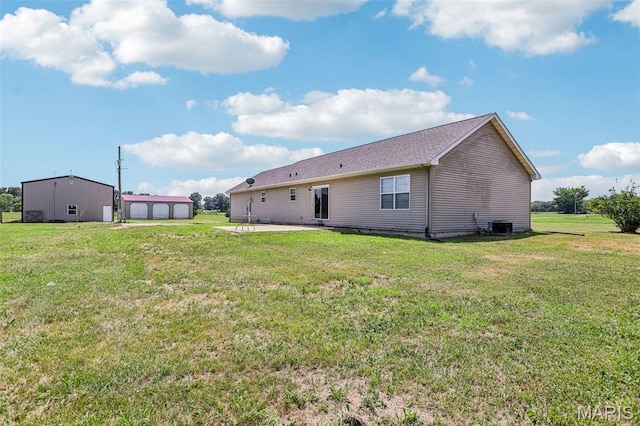 1518 Old Ripley Rd, Sorento, IL 62086 - rear view of house with an outdoor structure, a yard, and a patio area