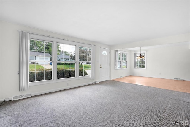 114 Macarthur St, New Haven, MO 63068 - carpeted spare room with a chandelier and baseboards