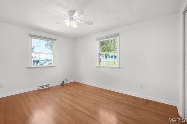 114 Macarthur St, New Haven, MO 63068 - empty room featuring light wood-type flooring and a ceiling fan