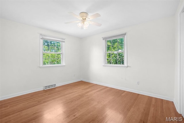 114 Macarthur St, New Haven, MO 63068 - unfurnished room featuring healthy amount of natural light, light wood finished floors, and a ceiling fan