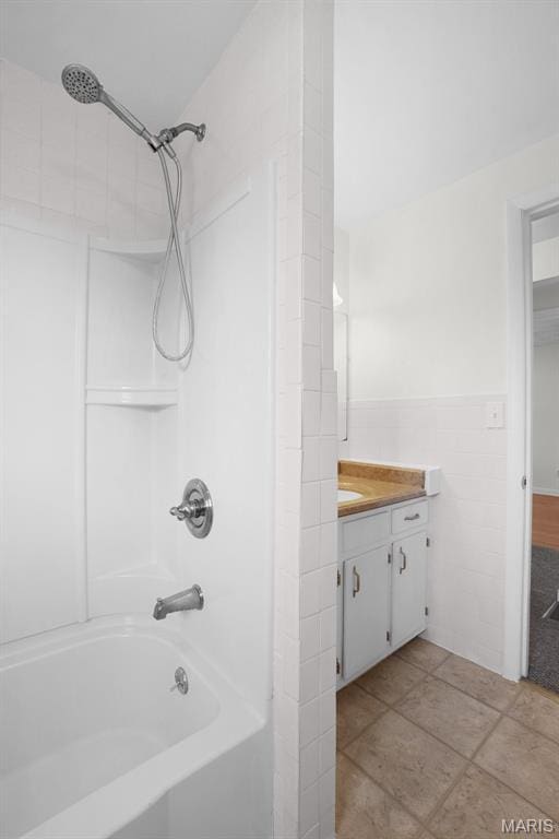 114 Macarthur St, New Haven, MO 63068 - full bathroom featuring tub / shower combination, vanity, tile walls, and wainscoting