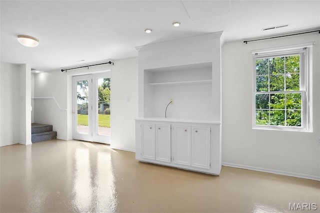 114 Macarthur St, New Haven, MO 63068 - unfurnished living room with concrete floors, stairway, and built in features