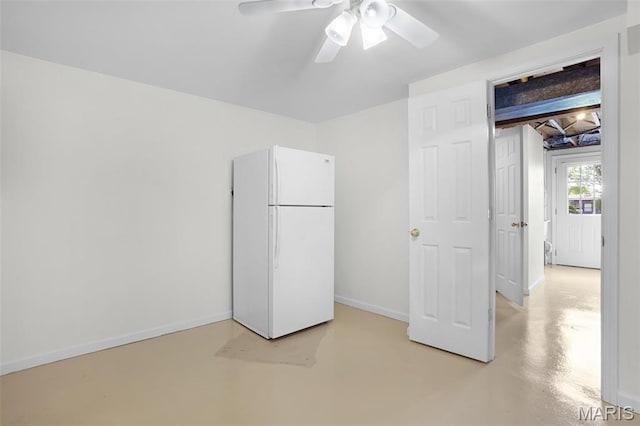 114 Macarthur St, New Haven, MO 63068 - unfurnished bedroom featuring freestanding refrigerator, finished concrete flooring, and a ceiling fan