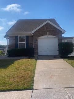 32 Brushy Brook Ct, Ofallon, MO 63366 - ranch-style house featuring driveway, an attached garage, and a front yard