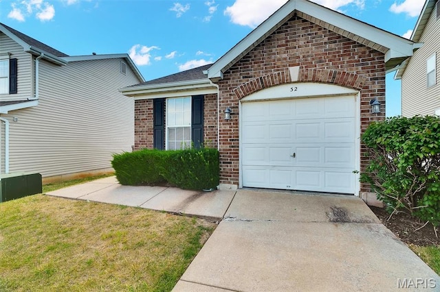 32 Brushy Brook Ct, Ofallon, MO 63366 - view of front of home with brick siding, concrete driveway, an attached garage, and a front yard