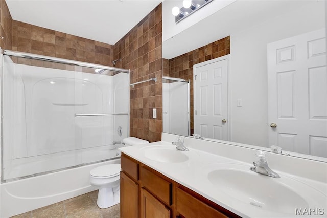 32 Brushy Brook Ct, Ofallon, MO 63366 - full bathroom with tile walls, shower / bath combination with glass door, and double vanity