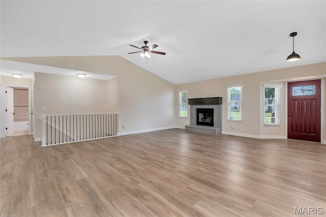 2601 Brookfield Ct, Columbia, IL 62236 - unfurnished living room with light wood finished floors, vaulted ceiling, ceiling fan, and a fireplace with raised hearth