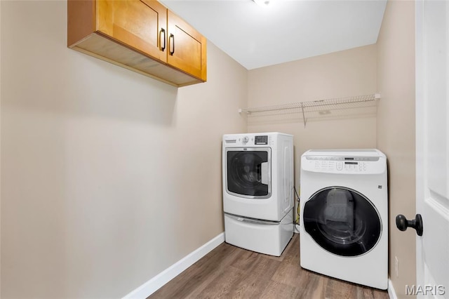 2601 Brookfield Ct, Columbia, IL 62236 - laundry room with washing machine and dryer, wood finished floors, and cabinet space