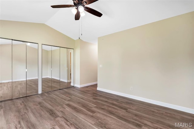 2601 Brookfield Ct, Columbia, IL 62236 - unfurnished bedroom featuring two closets, vaulted ceiling, wood finished floors, and a ceiling fan
