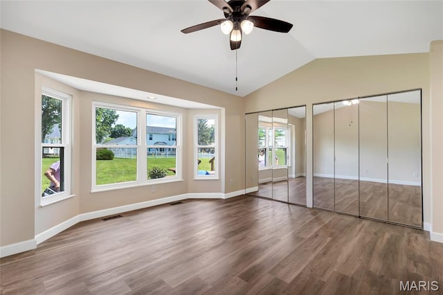 2601 Brookfield Ct, Columbia, IL 62236 - unfurnished bedroom featuring two closets, wood finished floors, vaulted ceiling, and a ceiling fan