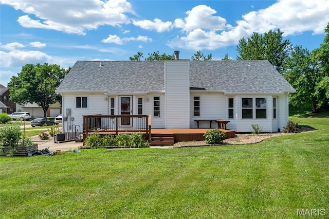 2601 Brookfield Ct, Columbia, IL 62236 - rear view of house with a deck, a yard, a shingled roof, and a chimney