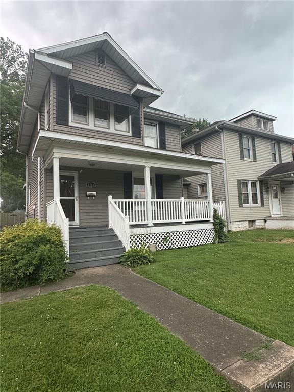 2544 State St, Granite City, IL 62040 - view of front of home featuring covered porch and a front yard