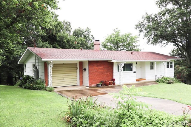 337 S Elm St, Dexter, MO 63841 - ranch-style house with a chimney, driveway, a front yard, and brick siding