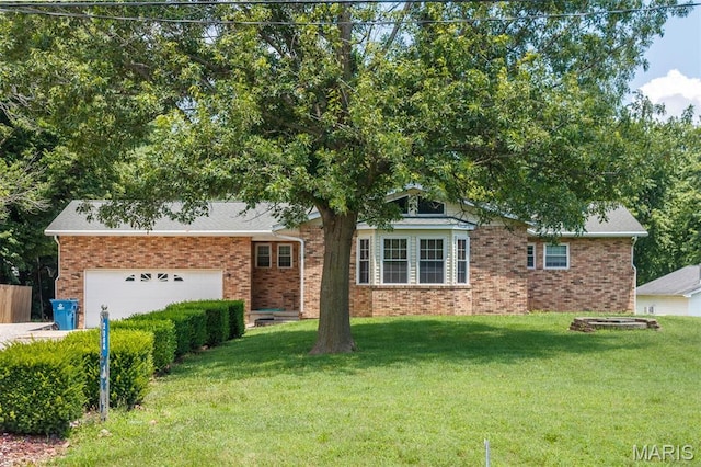 2364 Marine Rd, Highland, IL 62249 - ranch-style house featuring an attached garage, a front lawn, and brick siding