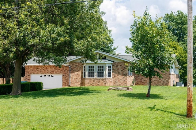 2364 Marine Rd, Highland, IL 62249 - single story home featuring a garage, a front yard, and brick siding
