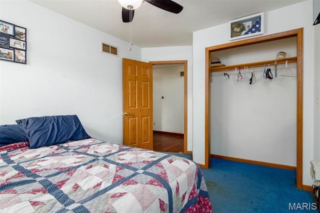 2364 Marine Rd, Highland, IL 62249 - carpeted bedroom with a closet, a ceiling fan, and a textured ceiling