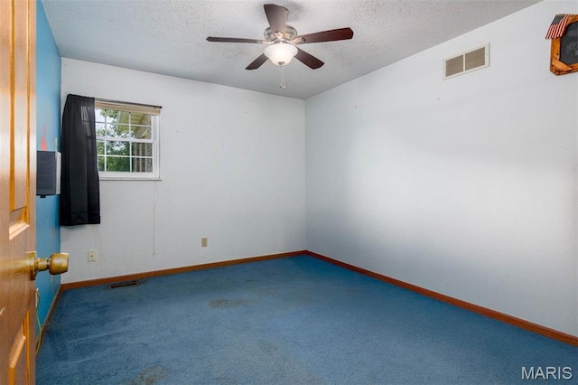 2364 Marine Rd, Highland, IL 62249 - carpeted empty room with a textured ceiling and a ceiling fan
