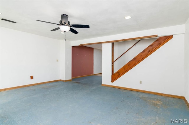 2364 Marine Rd, Highland, IL 62249 - spare room featuring finished concrete floors, a ceiling fan, stairs, and recessed lighting