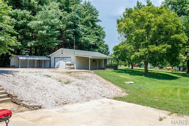 2364 Marine Rd, Highland, IL 62249 - garage featuring driveway and view of scattered trees