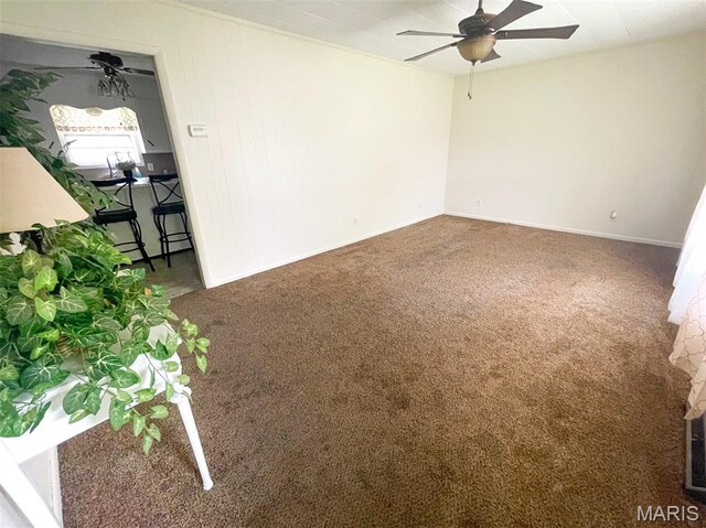 304 W Oak St, Dexter, MO 63841 - carpeted empty room with a ceiling fan and baseboards