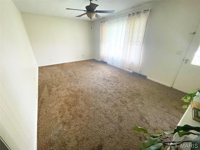 304 W Oak St, Dexter, MO 63841 - spare room featuring carpet flooring and a ceiling fan