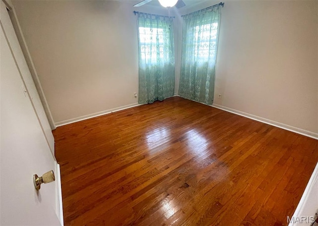 304 W Oak St, Dexter, MO 63841 - unfurnished room with dark wood-style floors and ceiling fan