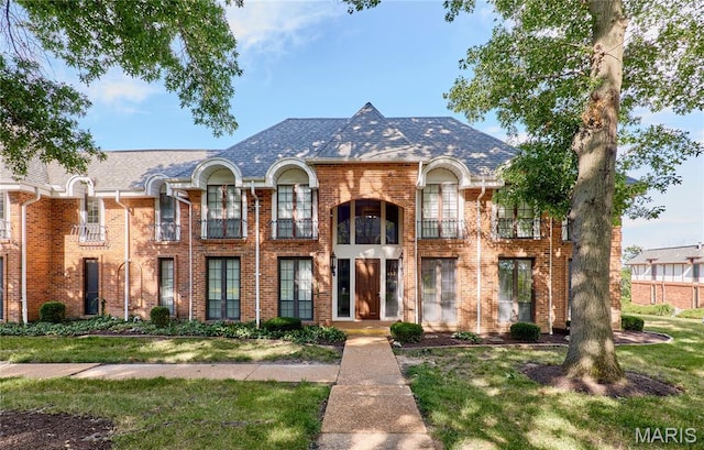 922 Claytonbrook Dr Unit 2, Ballwin, MO 63011 - view of front of property featuring brick siding, a balcony, and a front yard