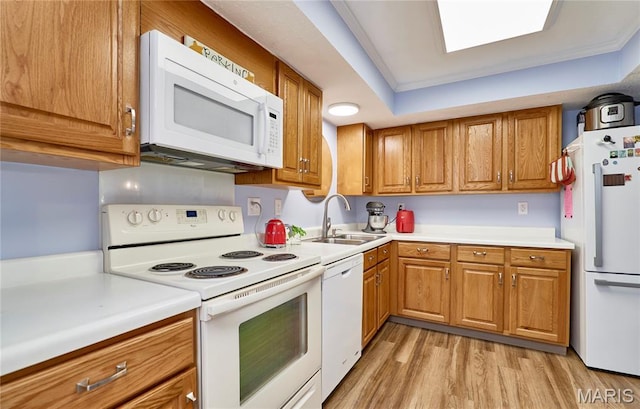 922 Claytonbrook Dr Unit 2, Ballwin, MO 63011 - kitchen featuring white appliances, brown cabinetry, and light wood-style flooring