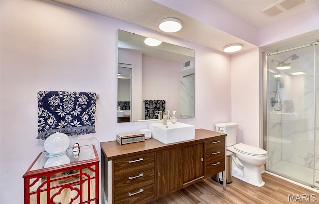 922 Claytonbrook Dr Unit 2, Ballwin, MO 63011 - full bathroom featuring a stall shower, vanity, and wood finished floors