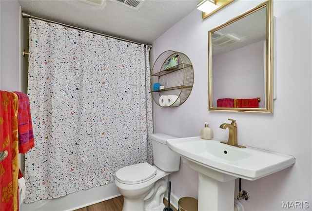 922 Claytonbrook Dr Unit 2, Ballwin, MO 63011 - full bathroom with wood finished floors and shower / tub combo with curtain