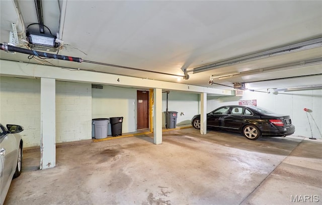 922 Claytonbrook Dr Unit 2, Ballwin, MO 63011 - parking garage featuring a garage door opener