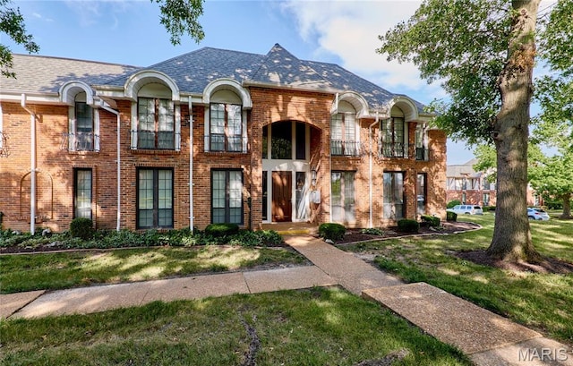 922 Claytonbrook Dr Unit 2, Ballwin, MO 63011 - view of front of home with brick siding and a front lawn