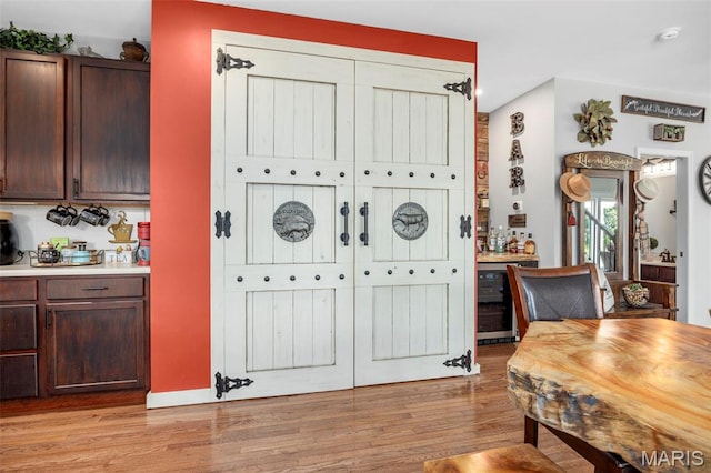 7742 Ardmore Dr, Ofallon, MO 63368 - dining room featuring light wood-style flooring and beverage cooler