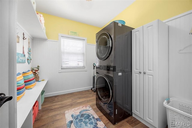 7742 Ardmore Dr, Ofallon, MO 63368 - laundry room with stacked washer / drying machine and wood finished floors