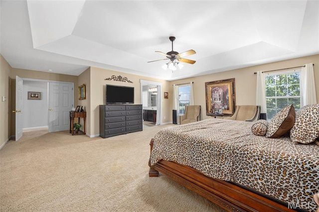7742 Ardmore Dr, Ofallon, MO 63368 - bedroom featuring a raised ceiling, carpet floors, ceiling fan, and connected bathroom