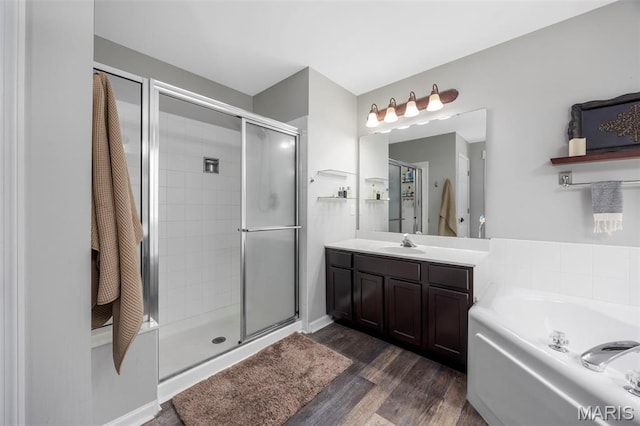 7742 Ardmore Dr, Ofallon, MO 63368 - full bathroom with a stall shower, wood finished floors, vanity, and a garden tub