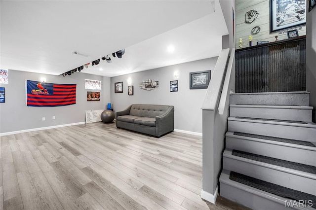 7742 Ardmore Dr, Ofallon, MO 63368 - living room featuring wood finished floors and stairway