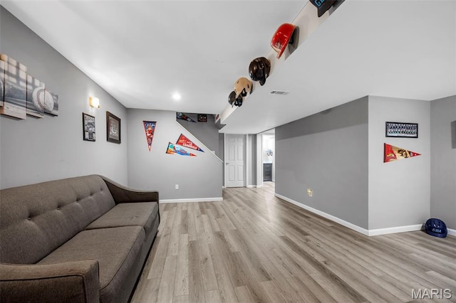 7742 Ardmore Dr, Ofallon, MO 63368 - living room featuring light wood-style flooring and recessed lighting