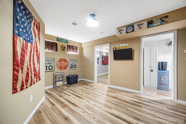 7742 Ardmore Dr, Ofallon, MO 63368 - spare room with wood finished floors and baseboards