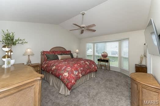 1405 Sunburst Dr, O'Fallon, MO 63366 - bedroom featuring carpet flooring, vaulted ceiling, and ceiling fan