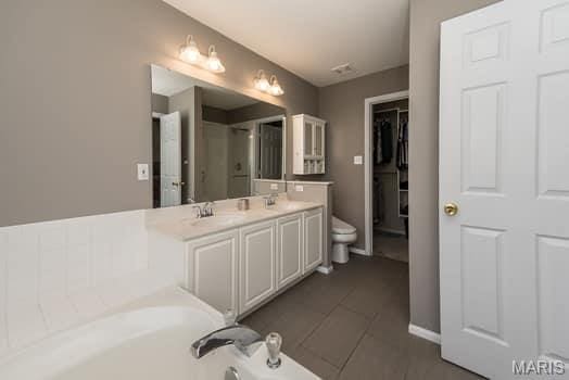 1405 Sunburst Dr, O'Fallon, MO 63366 - bathroom featuring double vanity, an enclosed shower, and a bath