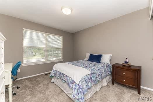 1405 Sunburst Dr, O'Fallon, MO 63366 - bedroom featuring carpet flooring and an office area