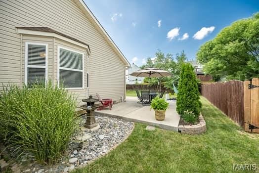 1405 Sunburst Dr, O'Fallon, MO 63366 - view of yard featuring a patio