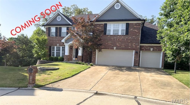 610 Legends Bluffs Ct, Eureka, MO 63025 - view of front of home with a front yard, an attached garage, brick siding, and driveway