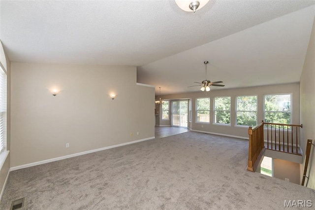 563 Great Plains Dr, House Springs, MO 63051 - empty room featuring lofted ceiling, carpet floors, a ceiling fan, and a chandelier