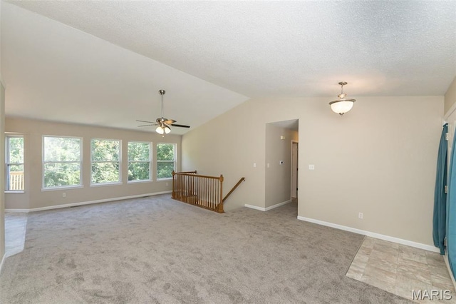 563 Great Plains Dr, House Springs, MO 63051 - carpeted spare room featuring ceiling fan, vaulted ceiling, and a textured ceiling