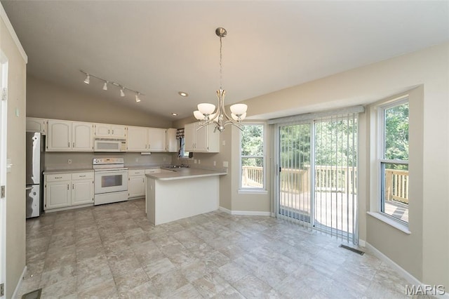 563 Great Plains Dr, House Springs, MO 63051 - kitchen with white appliances, a chandelier, vaulted ceiling, light countertops, and white cabinets