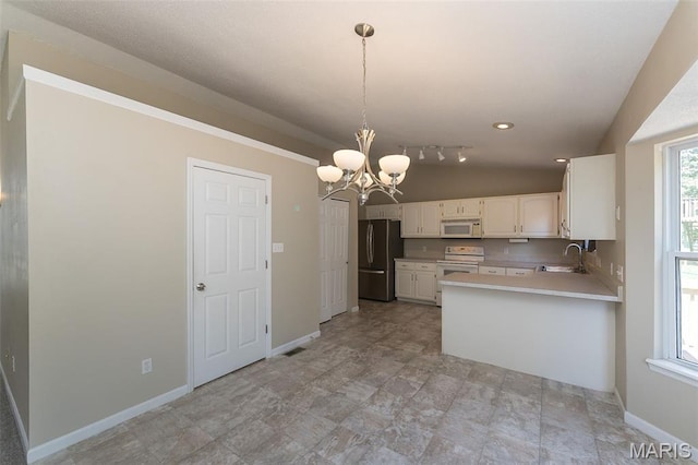 563 Great Plains Dr, House Springs, MO 63051 - kitchen featuring white appliances, a chandelier, light countertops, white cabinetry, and a peninsula