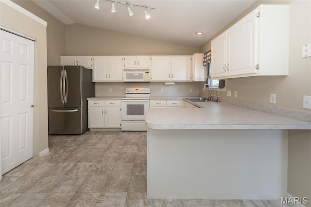 563 Great Plains Dr, House Springs, MO 63051 - kitchen featuring white appliances, lofted ceiling, a peninsula, light countertops, and white cabinetry